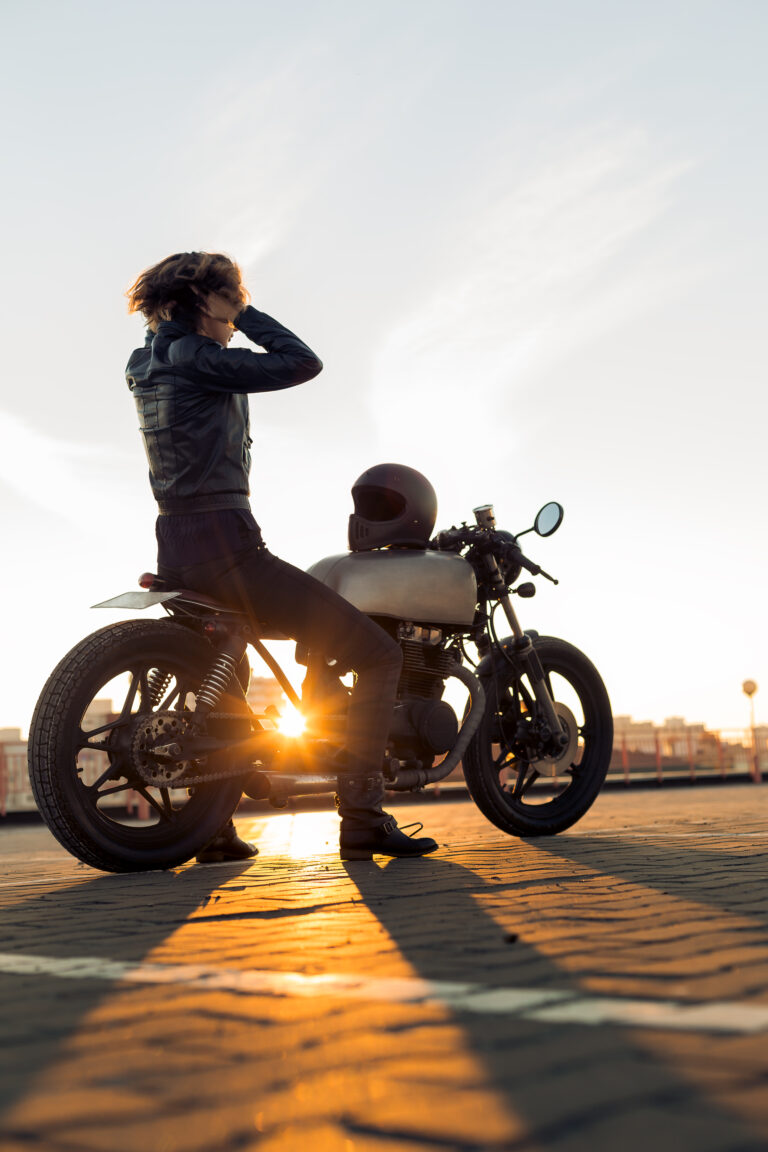 Biker girl on caferacer motorcycle