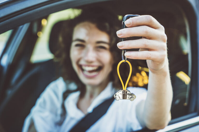 Blog - Bucher Insurance, Miamisburg, Ohio Happy woman buying new car - Delightful girl showing auto keys t